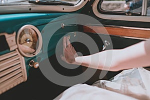 female hands in a retro car. Stylish old car. Retro