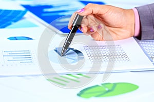 Female hands reviewing accounting documents