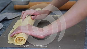 Female Hands Rolling Dough into Rolls, Baking Process Making Buns.