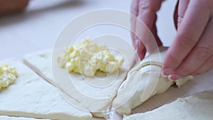 Female Hands Rolling Dough into Rolls Baking Process Making Croissant Bakery process of cooking baking croissants