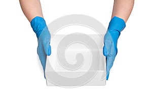 Female hands in rubber gloves holding cardboard box