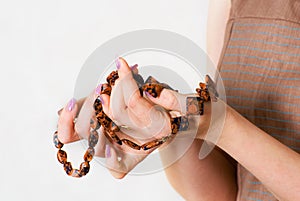Female hands show beautiful necklace photo