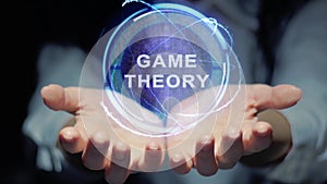 Female hands show hologram Game theory