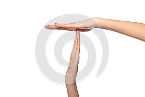 Female hands show a timeout or pause sign on white background. photo