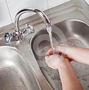 Female hands in soap