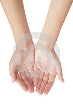 Female hands are stretching something on a white background. View from above