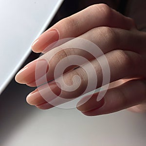 Female hands with stylish pink manicure on white background