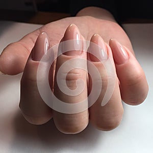 Female hands with stylish pink manicure on white background