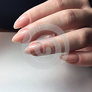 Female hands with stylish pink manicure on white background