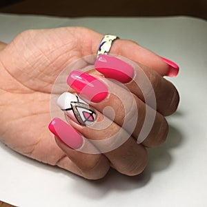 Female hands with stylish red manicure on grey background