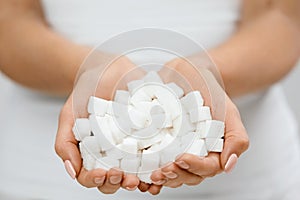 Female Hands With Sugar Cubes.