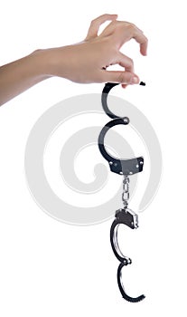 Female hands in tight fist on handcuff on white isolated background