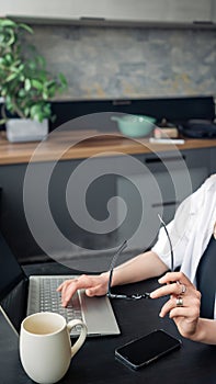 Female hands typing on computer keyboard closeup, business woman or student using laptop at home, online learning