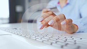 Female hands typing credit card number on computer keyboard. Woman making online purchase. Online payment service.