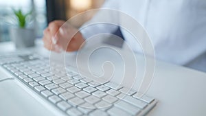 Female hands typing credit card number on computer keyboard. Woman making online purchase. Online payment service.