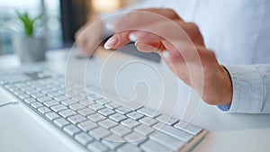 Female hands typing credit card number on computer keyboard. Woman making online purchase. Online payment service.