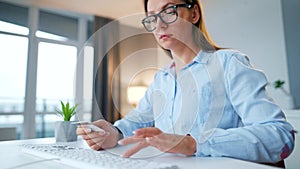 Female hands typing credit card number on computer keyboard. Woman making online purchase. Online payment service.