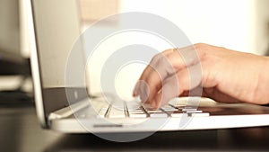female hands typing keyboard laptop
