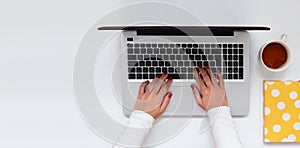 Female hands typing on keyboard laptop, banner with copy space, for bloggers, business. Top view, flat lay