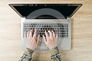 Female hands typing laptop computer keyboard, top view