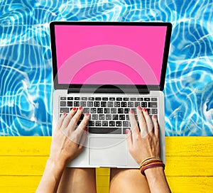 Female Hands Typing Macbook Poolside Concept photo