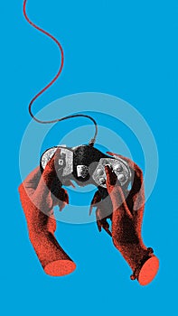 Female hands using game controller over blue background. Online video games, leisure time, Grainy effect. Contemporary