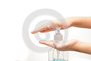 Female hands using hand sanitizer gel pump dispenser.