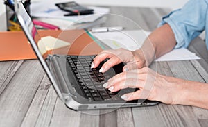 Female hands using a laptop