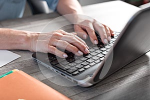 Female hands using a laptop