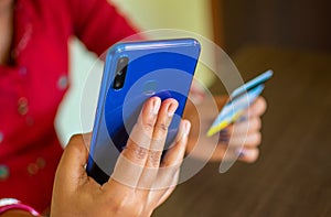 Female hands using mobile banking on smart phone