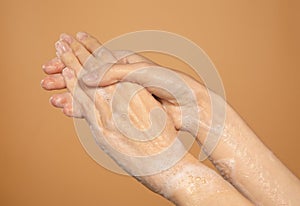 Female hands washing in foam