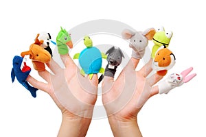 Female hands wearing 10 finger puppets photo