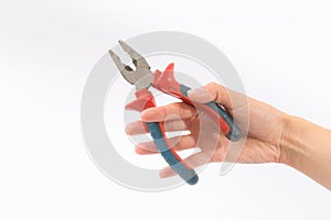 Female hands on a white background with pliers