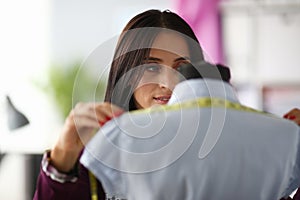 Female hands in the workshop hold