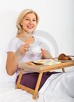 Female having breakfast in bed