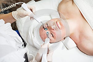 Female having hydradermie facial treatment in in beauty clinic
