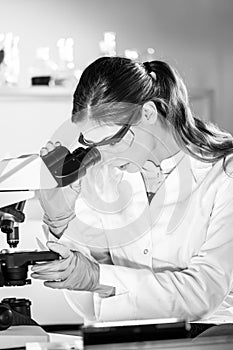 Female health care researchers working in scientific laboratory.