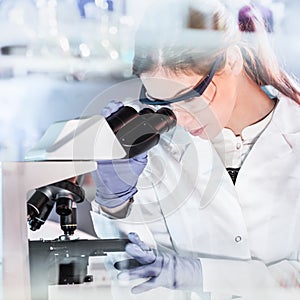 Female health care researchers working in scientific laboratory.