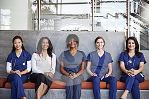 Female healthcare workers sitting together in a hospital