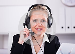 Female helpline operator with headphones