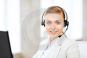 Female helpline operator with headphones