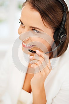 Female helpline operator with headphones