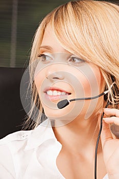 Female helpline operator with headphones