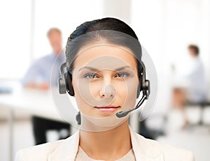 Female helpline operator with headphones