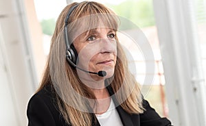 Female helpline operator in headset