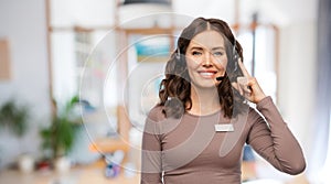 female helpline operator with headset and name tag