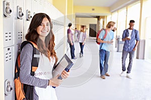 Female High School Student Standing By Lockers