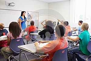 Female High School Teacher Taking Class