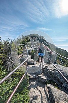 Female hiker enjoying the view from the trail to the summit of Whiteface Mountain