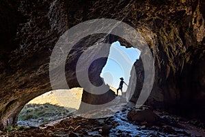 Female hiker exploring caves in Ausralia